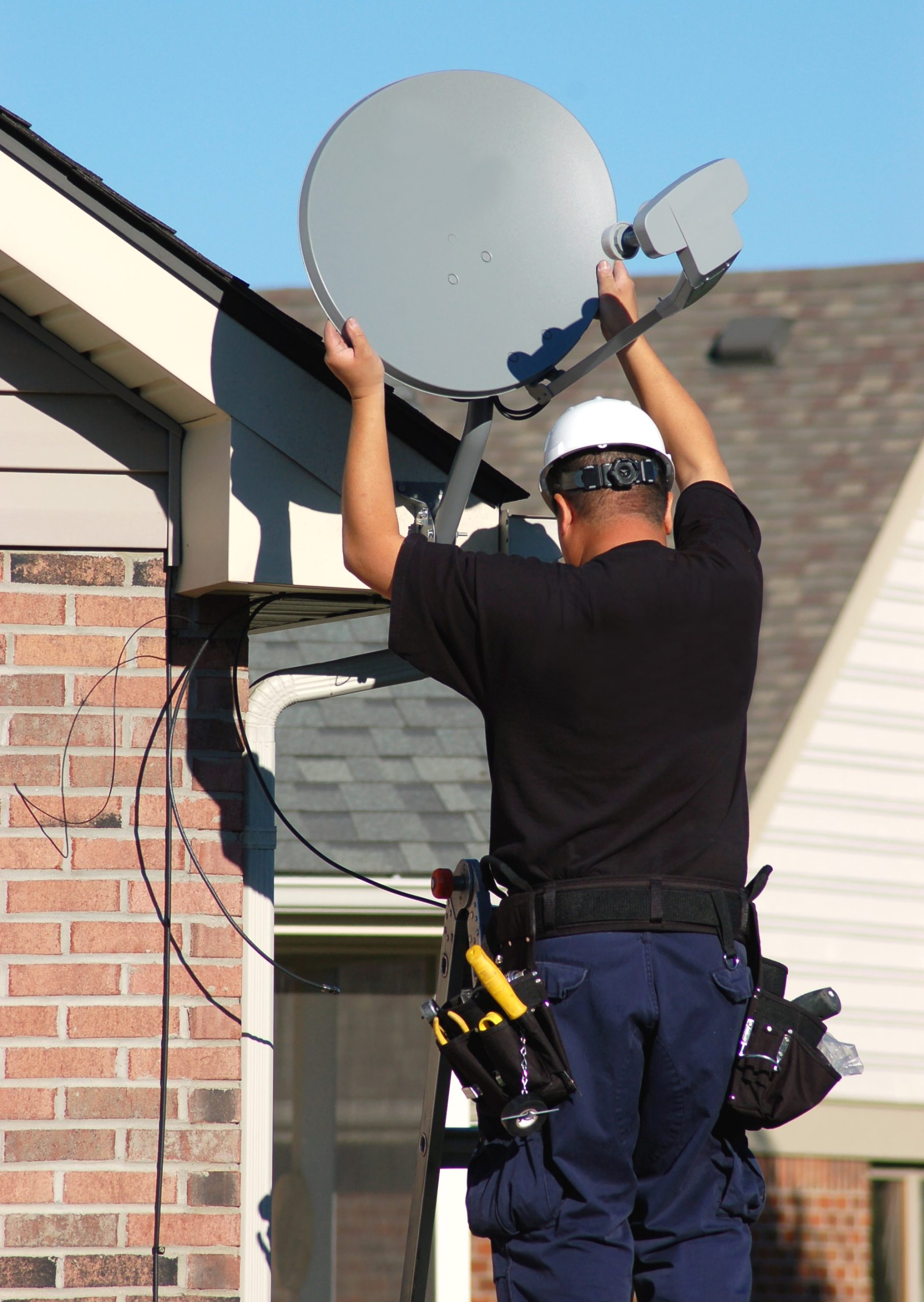 Technician installing satellite equipment
